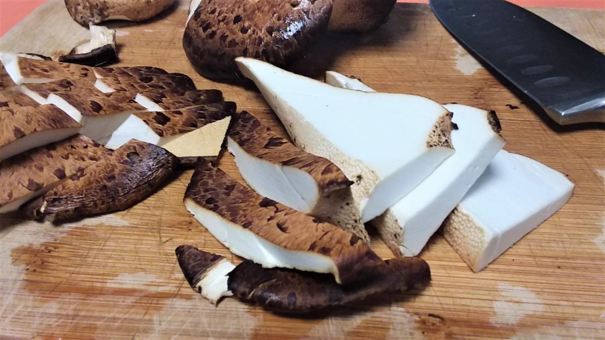 Sliced dryad's saddle mushroom on a cutting board