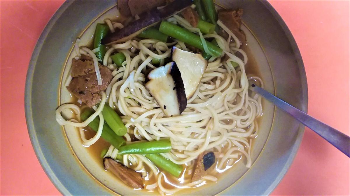 Ramen noodle soup with sautéed dryad's saddle mushroom on top