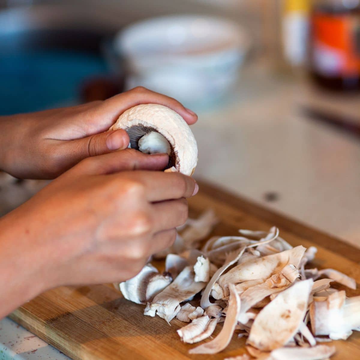 kid cleaning mushrooms